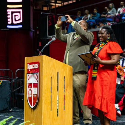 Denniston Bonadie taking a photo of the crowd during the presentation of the RAAA award