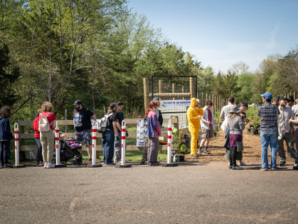 Community participants lining up to register for a tree planting event