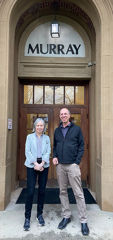 Woman and man standing in front of Murray Hall on the Rutgers--New Brunswick campus.