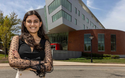 Rutgers-New Brunswick student Asmi Kaushal poses outside the Richard Weeks Hall of Engineering.
