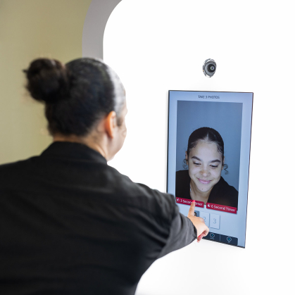 Ismel Martinez Sanchez, a sophomore studying criminal justice and psychology at the School of Arts and Sciences, demonstrates how to take a headshot.