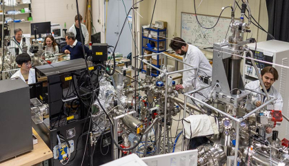 Scientists work on a physics experiment in a lab