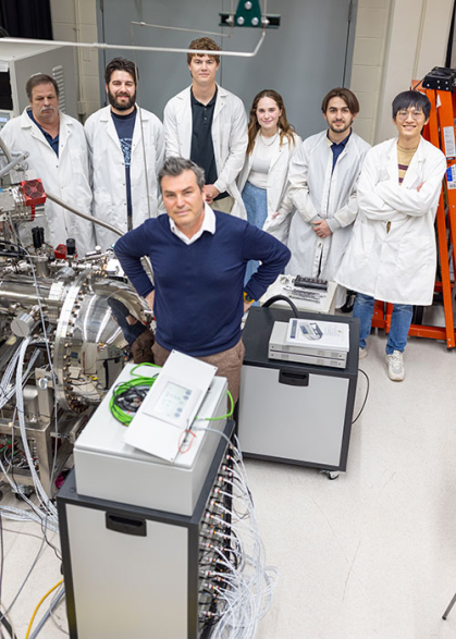 Scientists in a lab lined up.
