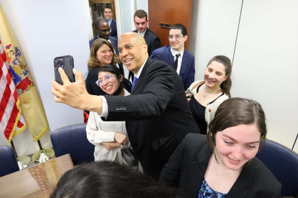 Cory Booker taking a selfie with students