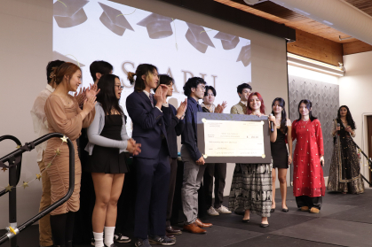 student organization on stage receiving an award