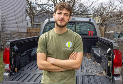 Josh Kover, a senior majoring in landscape architecture, stands behind his truck in New Brunswick, N.J.