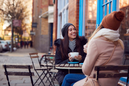 Friends meeting outside for coffee