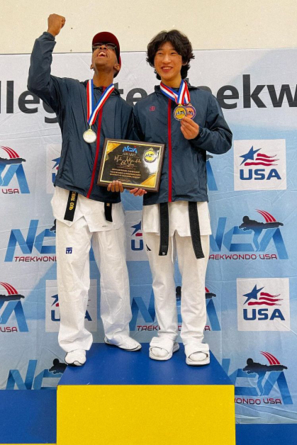 Malik Dobson and Ian Hong stand on the podium at the 2024 National Collegiate Taekwondo Association Championships held in April in California