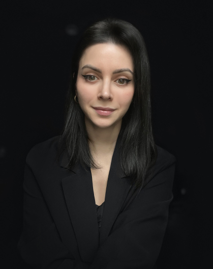 Heather Pinheiro wearing black on a black background