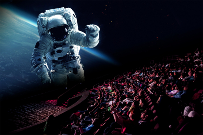 Astronaut on the movie screen at the Jennifer Chalsty Planetarium