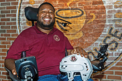 Eric LeGrand with logo of LeGrand Coffee House on New Jersey Devils helmet
