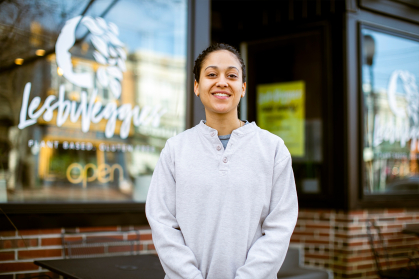 Rutgers-Camden Alumna Brennah Lambert in front of Lesbiveggies