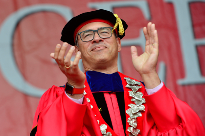 Rutgers President Holloway applauding graduates during 2022 Commencement