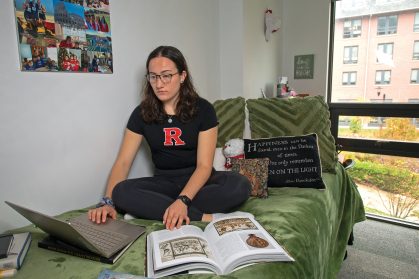 Rutgers student studying in her dorm room.