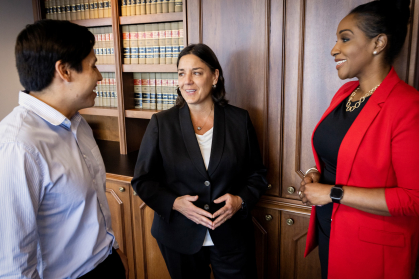 Jacqueline Romero is pictured with Saul Molina, left, a student at Rutgers Law School who is working as a legal assistant in the U.S. Attorney’s Office. Angella Middleton CLAW’15, right, is an Assistant U.S. Attorney.