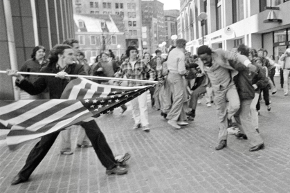 Historic image of white protester attacking Black man in 1976