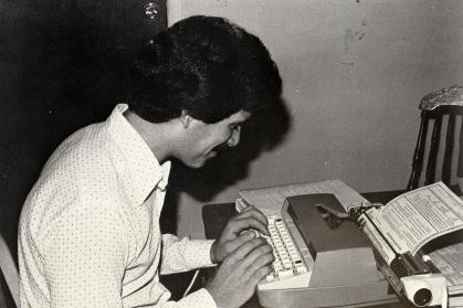 Student on a type writer