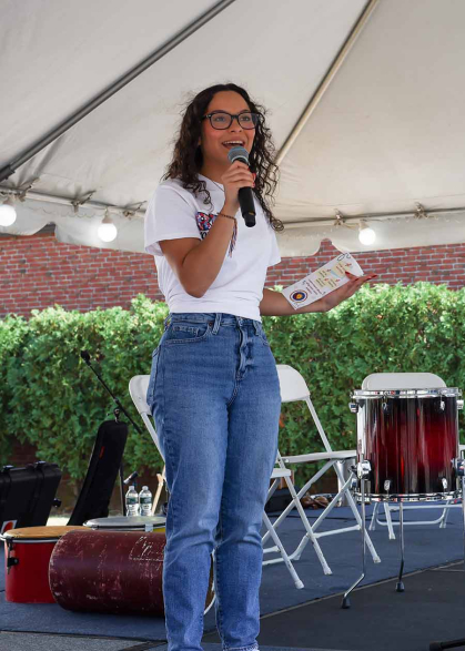 Alejandra Afanador introduces herself as an RU Voting Ambassador during a registration event at the Center for Latino Arts and Culture on Sept. 22.