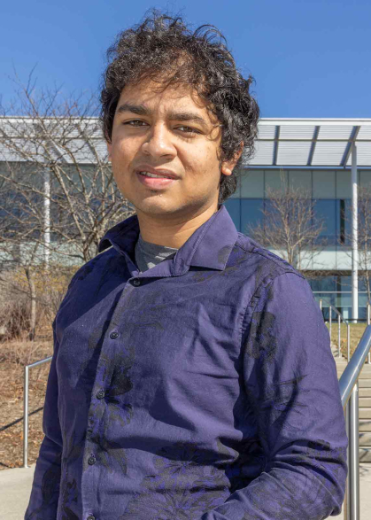 Mukhilan Saravanakumar poses on Cook campus at Rutgers University-New Brunswick.