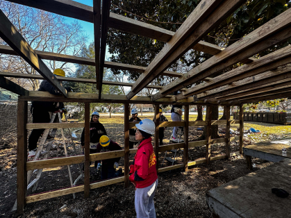 Rutgers-Newark students reinforcing a shed in Kentucky