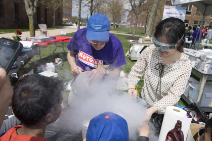 Chemistry lecturer Paul Kimmel and Tianyi Yiang make ice cream with liquid nitrogen during Rutgers Day 2018 on Busch campus.