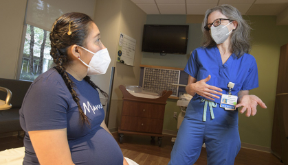 Julie Blumenfeld confers with expectant mother Lleymi Brenes at the Capital Health Medical Center in Pennington, N.J.