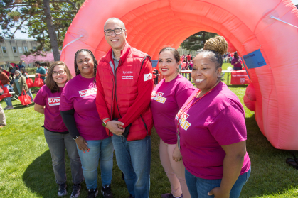 Jonathan Holloway with volunteers wearing Rutgers Day Shirts
