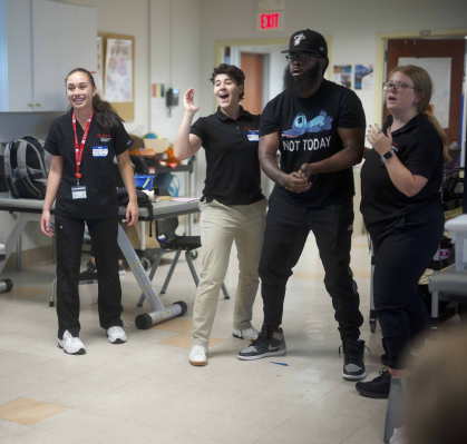 Brianna Lally (third from right) provides team-based care in a SHP pro bono clinic aimed helping those with traumatic brain injury improve their cognitive and motor functions.
