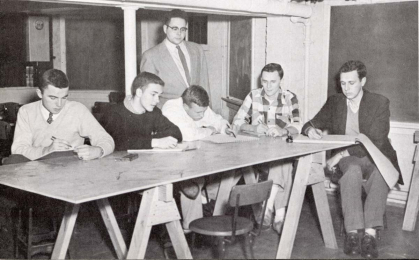 In this image from a 1955 yearbook, George Segal (standing, center) advises a student art club at Rutgers.