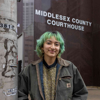 Rutgers senior Stephanie Gomez-Vanegas poses outside the Middlesex County Courthouse in New Brunswick, N.J.