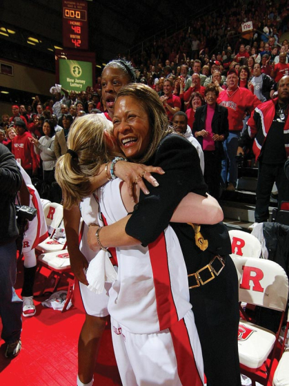 C. Vivian Stringer embracing a player.