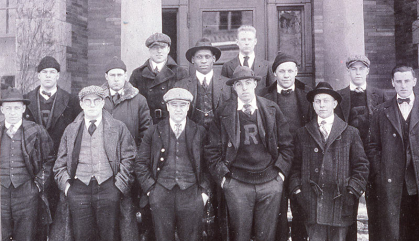 Paul Robeson poses for a photograph surrounded by other members of the Rutgers Varsity Club.