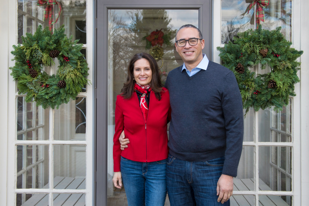 President Jonathan Holloway and his wife, Aisling Colón, outside the front entrance to the President’s House.