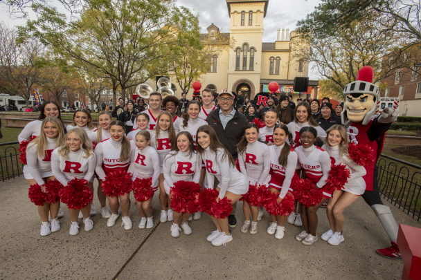 President Holloway with the cheerleading team 