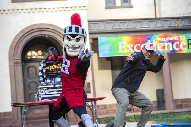 President Holloway posing with the Scarlet Knight