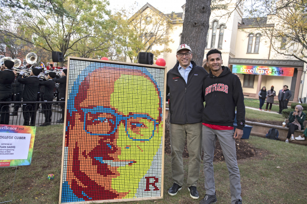 President Holloway admires the creation of his image out of Rubik Cubes by Dylan Sadiq (SOE '22) at the Excellence Fest