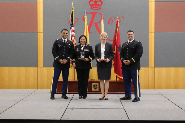 Brigadier General Lisa J. Hou and Vice Provost Carolyn Moehling being presented with awards