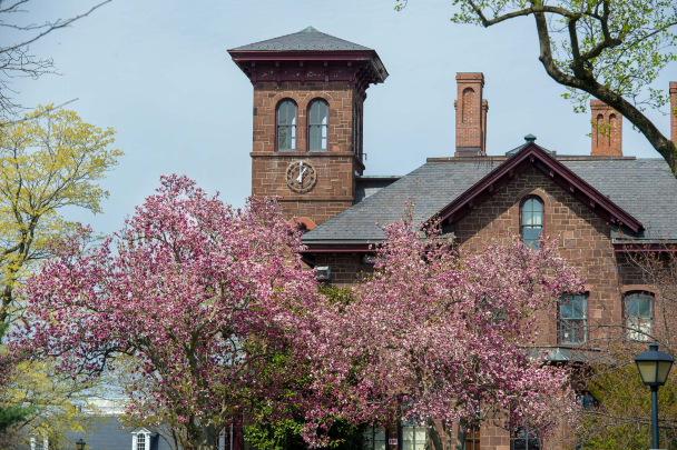  View of College Hall surrounded by emerging cherry blossoms in New Brunswick on the Douglass Campus