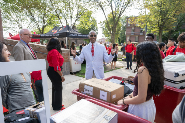 President tate greets students at move in 